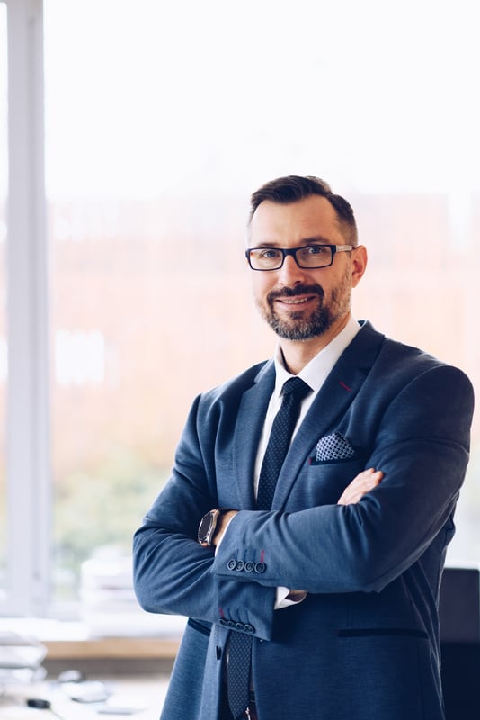 40 years old handsome businessman in suit at office